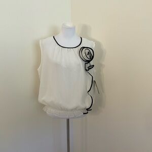 Women's White Sleeveless Blouse with Black Trim and Rosette Detail